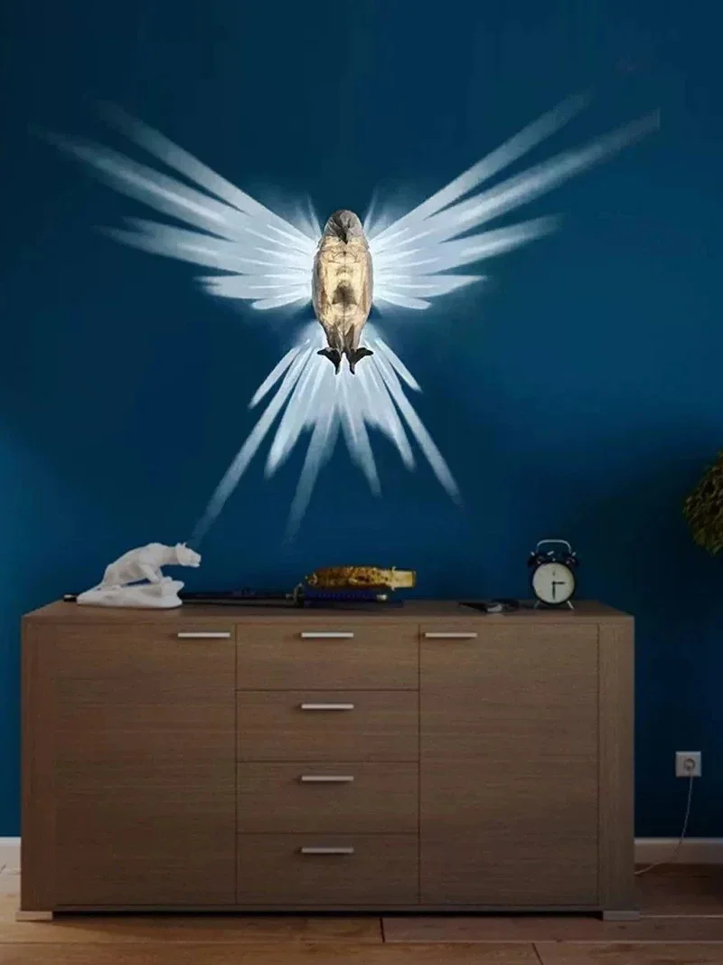 Illuminated Crystal Bird Lamp Casting Angel Wing Light Pattern