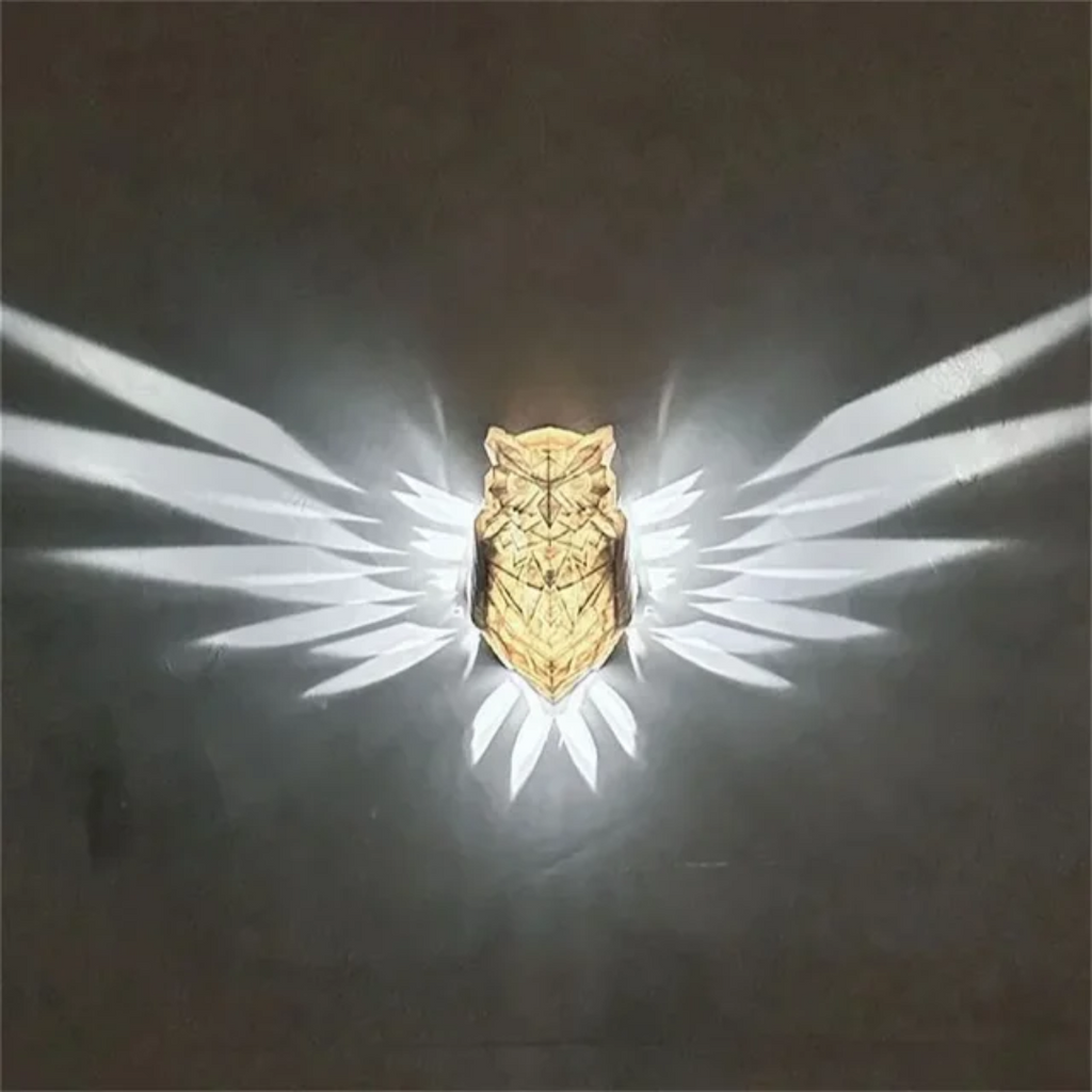 Illuminated Crystal Bird Lamp Casting Angel Wing Light Pattern