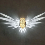 Illuminated Crystal Bird Lamp Casting Angel Wing Light Pattern